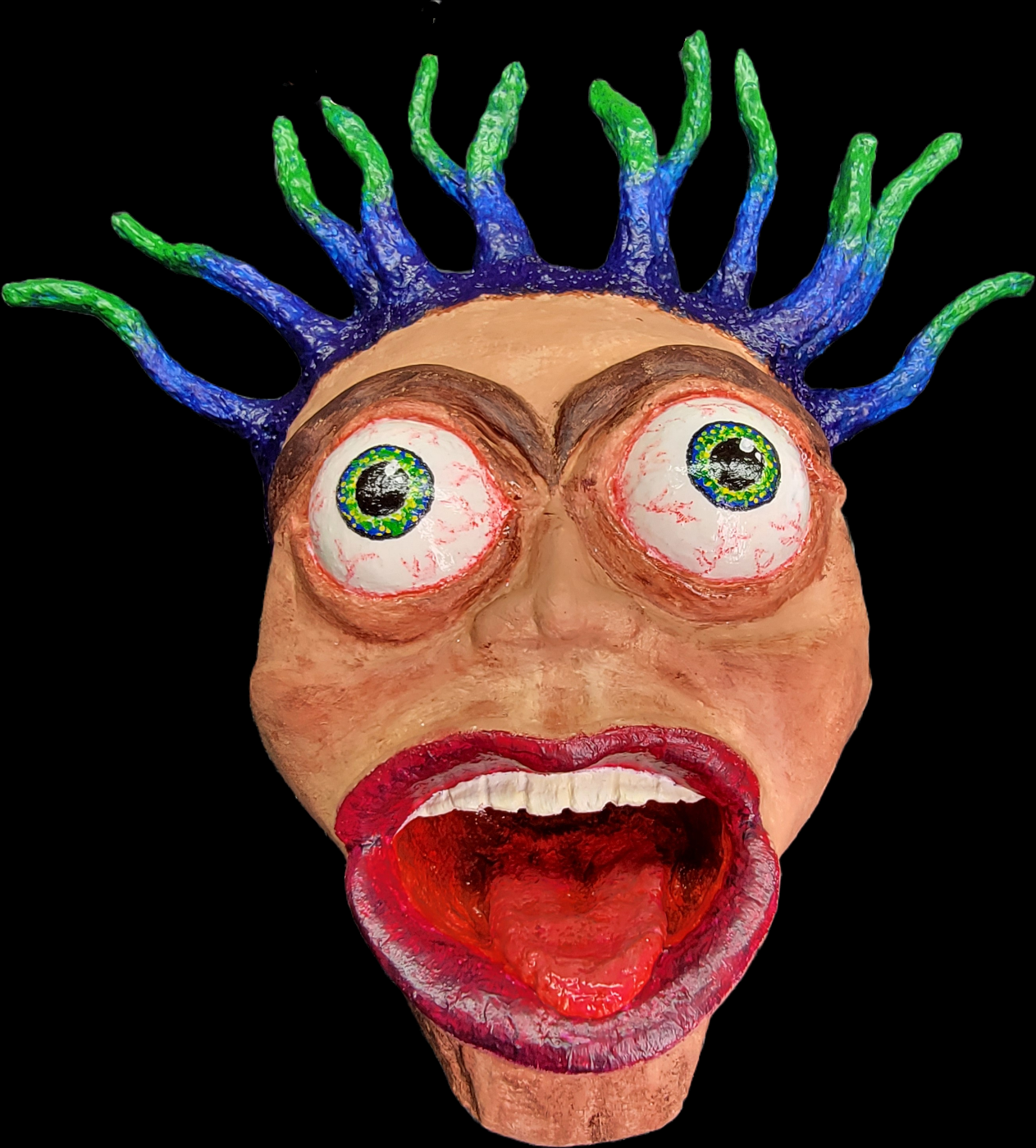 Decorative wall art mask. Bug eyed, hair standing on end with the mouth wide open in a scream.